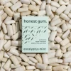 Honest Gum Eucalyptus Mint Plasitic Free Natural 17g laying on top of a pile of gum