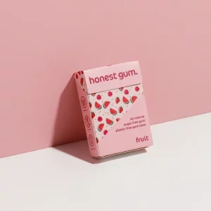 Honest Gum Fruit Plasitic Free Natural 17g leaning against a wall with the front of the packaging showing.