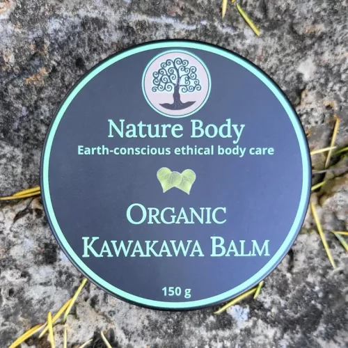 Looking into a container of Nature Body Kawakawa Balm 30g with the lid on