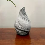Zurma Diffuser Glass Vase Swirl on a wood table