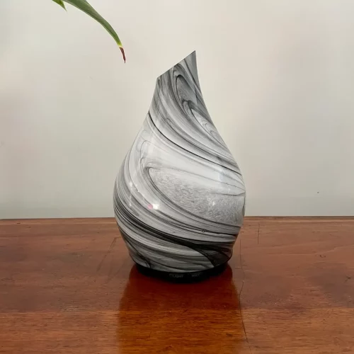 Zurma Diffuser Glass Vase Swirl on a wood table