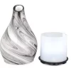Zurma Diffuser Glass Vase Swirl piece next to it's internal diffuser.