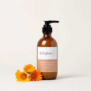 HerbFarm Body Lotion May Chang Uplifting 200ml next to calendula flowers