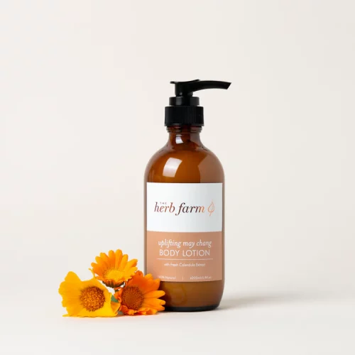 HerbFarm Body Lotion May Chang Uplifting 200ml next to calendula flowers