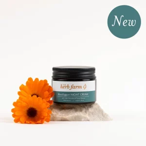HerbFarm Meno Support Night Cream 50ml on a stone next to Calendula flowers