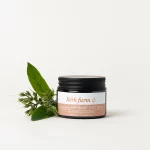 HerbFarm Rejuvinating Peppermint Foot Balm 50ml next to a sprig of Swedish bitters