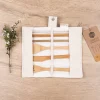 Unrolled Honeywrap Reusable Cutlery Set Cream on a wooden table