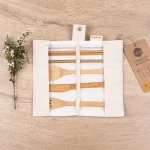 Unrolled Honeywrap Reusable Cutlery Set Cream on a wooden table