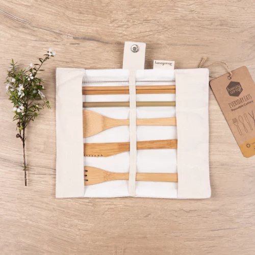 Unrolled Honeywrap Reusable Cutlery Set Cream on a wooden table