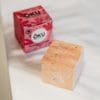Oku Kawakawa & Horopito Soap bar on a counter top sitting next to its packaging
