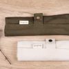Rolled up Honeywrap Reusable Cutlery Set Green on a wooden table