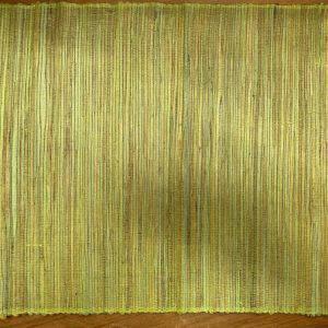 a Voodoo Woven Placemat Dusty Green on a wood table