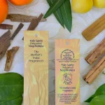 MothersFragrances Palo Santo Nagchampa on a table surrounded by incense