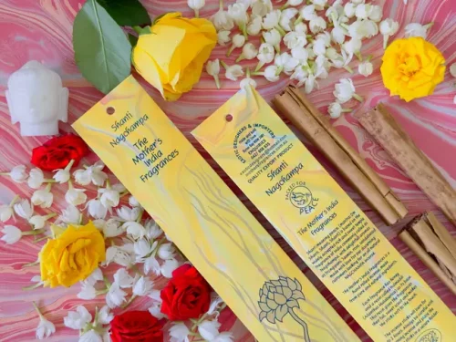 MothersFragrances Shanti Nagchamp on a table surrounded by incense