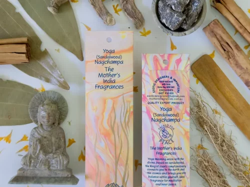 MothersFragrances Yoga Nagchampa on a table with a Budhha statue and incense