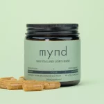 a jar of Mynd Pekepeke Lions Mane 60cps with a few capsules next to it