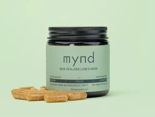 a jar of Mynd Pekepeke Lions Mane 60cps with a few capsules next to it