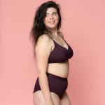 A woman wearing Nisa Albertine Womans Naturals Range Boysenberry coloured Bralette