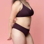 A woman wearing Nisa Quinn Woman Naturals Low Cotton Brief Boysenberry coloured
