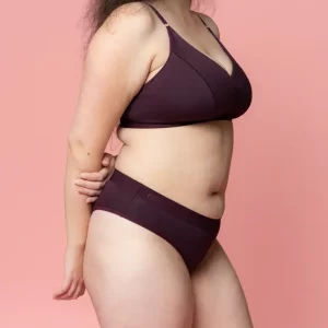 A woman wearing Nisa Quinn Woman Naturals Low Cotton Brief Boysenberry coloured