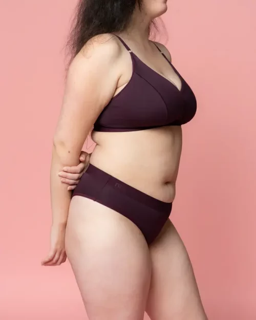 A woman wearing Nisa Quinn Woman Naturals Low Cotton Brief Boysenberry coloured