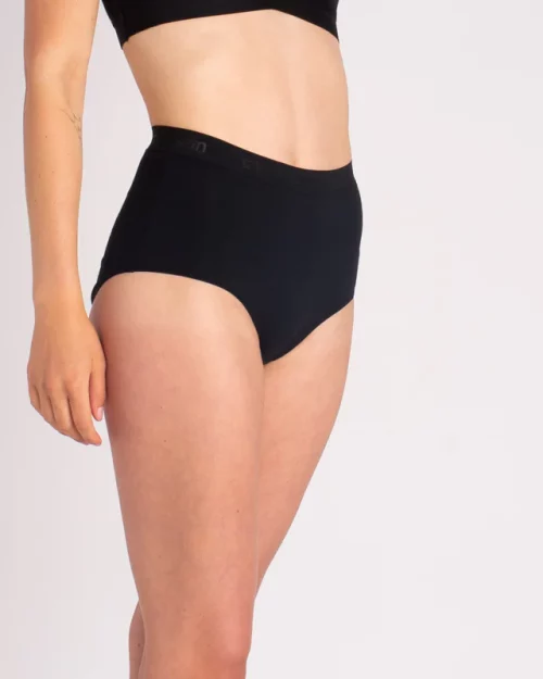A woman wearing Nisa Sabina Woman Naturals High Cotton Brief Black coloured