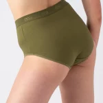 A woman wearing Nisa Sabina Woman Naturals High Cotton Brief Moss coloured