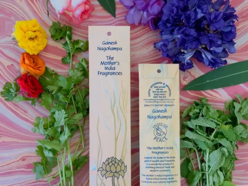 MothersFragrances Ganesh Nagchampa 20pk on a pink table surounded by flowers and herbs