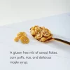 Natures Path Sunrise Crunchy Maple on a spoon on a marble counter top