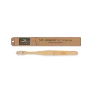 Go Bamboo Toothbrush Orthodontic next to its packaging