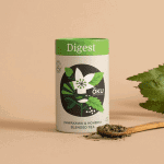 Oku Digest Tea Loose Leaf 30g on a table next to a spoon full of the loose leaf tea