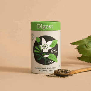 Oku Digest Tea Loose Leaf 30g on a table next to a spoon full of the loose leaf tea