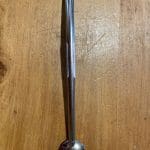 YerbaMate Straw Lollip Filter Stainless Steel on a wooden table