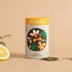 Oku Manuka – Manuka Blended Tea – Loose Leaf 30g on a table next to a pile of its loose leaf tea